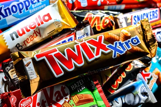 POZNAN, POL - NOV 20, 2024: Variety of popular brands of confectionery products