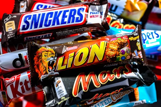POZNAN, POL - NOV 20, 2024: Variety of popular brands of confectionery products