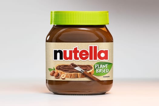 AACHEN, GERMANY - NOV 07, 2024: Pot of vegan plant based Nutella, the popular brand name of a sweetened hazelnut cocoa spread, introduced to the market in 1964 by Italian company Ferrero