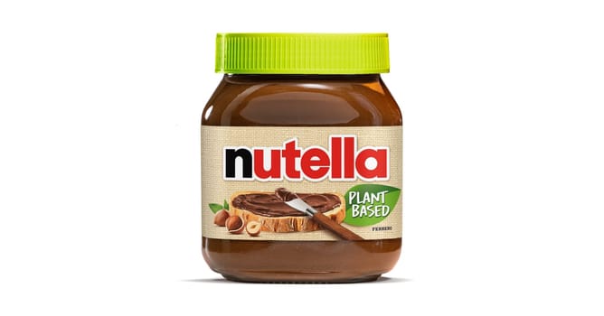 AACHEN, GERMANY - NOV 07, 2024: Pot of vegan plant based Nutella, the popular brand name of a sweetened hazelnut cocoa spread, introduced to the market in 1964 by Italian company Ferrero