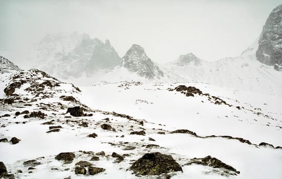 Mount Sayan in winter in the snow. The nature of the mountains is sayan.