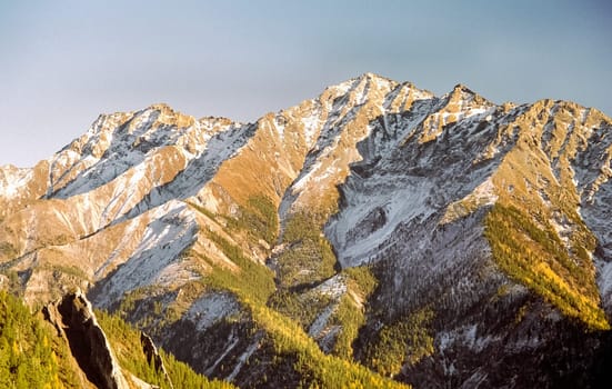Mount Sayan in winter in the snow. The nature of the mountains is sayan.