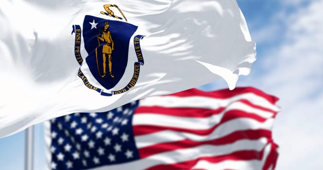 The flags of Massachusetts and the United States waving in the wind on a clear day. Patriotism and identity concept. 3d illustration render. Rippled fabric