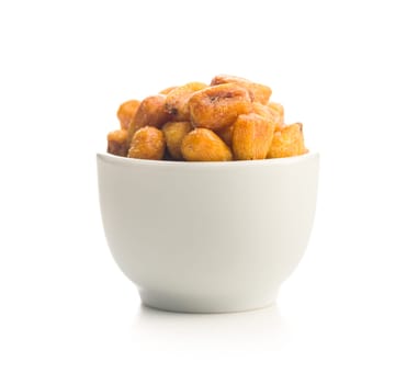Roasted salted corn snack in bowl isolated on a white background.