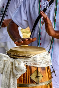 Drums decorated with fabric being used during an Umbanda ceremony in Brazil