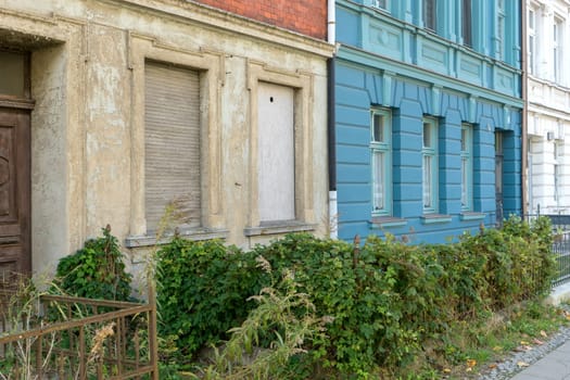 Detailed view of an old and a renovated house facade