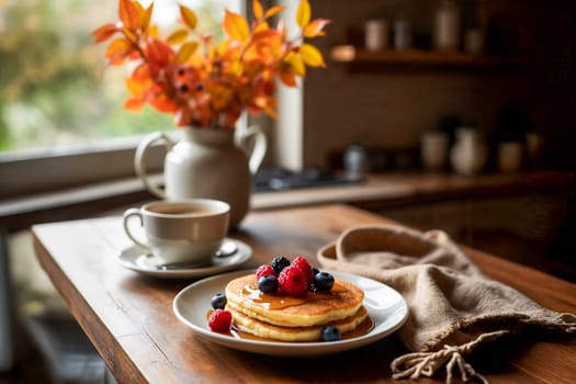 A warm and inviting breakfast scene featuring pancakes topped with syrup and fresh berries, paired with a cup of tea or coffee. Autumn, comfort, and delicious homemade meals