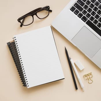 overhead view stationeries laptop beige background . Resolution and high quality beautiful photo