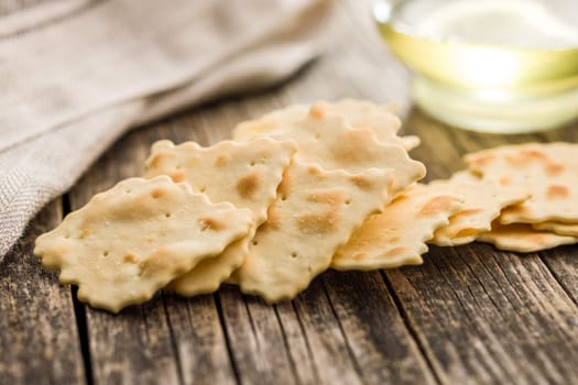 A crispy salted crackers  on a wooden table.