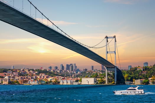 The boat near the Bosphorus bridge and modern Istanbul view, Turkey.