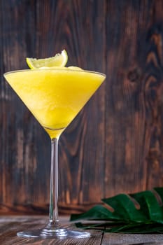 Frozen Banana Daiquiri with lime wedge garnish