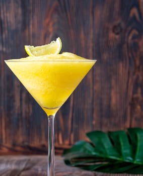 Frozen Banana Daiquiri with lime wedge garnish