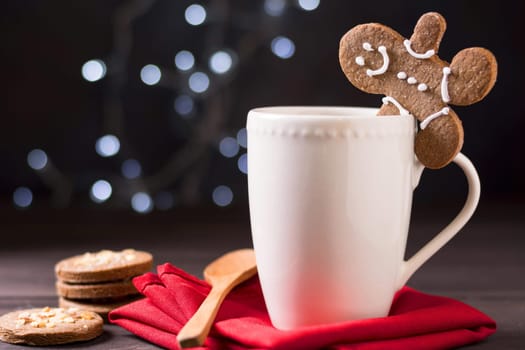 front view mug with gingerbread man biscuits