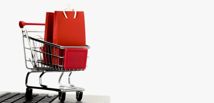front view shopping card with bags copy space cyber monday