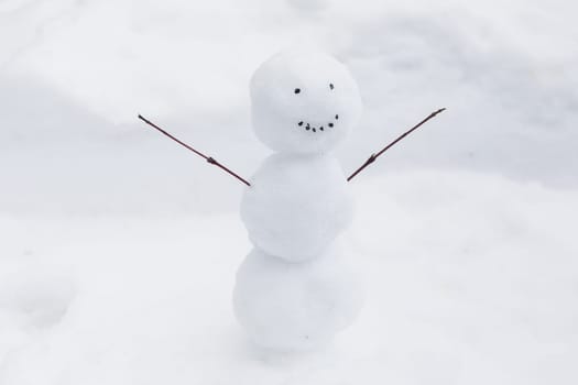 funny snowman snow bank