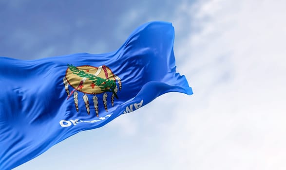 The Oklahoma state flag waving on a clear day. Oklahoma is a state in the South Central region of the United States. 3d illustration render. Rippling fabric