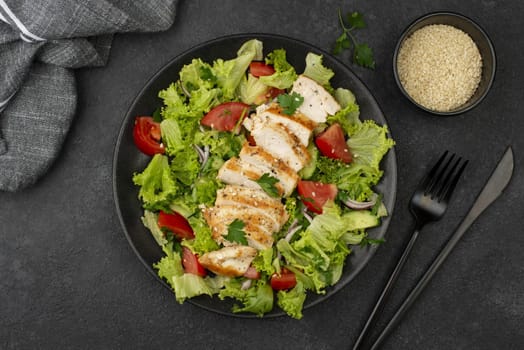 flat lay salad with chicken sesame seeds