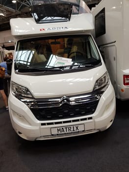 DUESSELDORF, NRW, GERMANY - AUGUST 29, 2018: Duesseldorf, Nrw, Germany - August 29, 2018: Motorhomes and campers for sale or rent at an exhibition. Concept freedom, family vacation trip, holiday trip with camper.