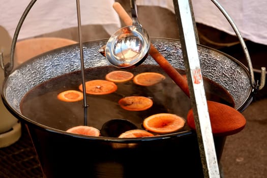 rustic pot with mulled wine on a German Christmas market