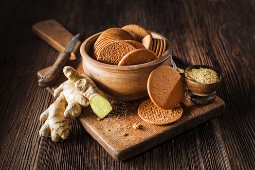 Delicious fresh homemade gingerbread cookies on rustic table background