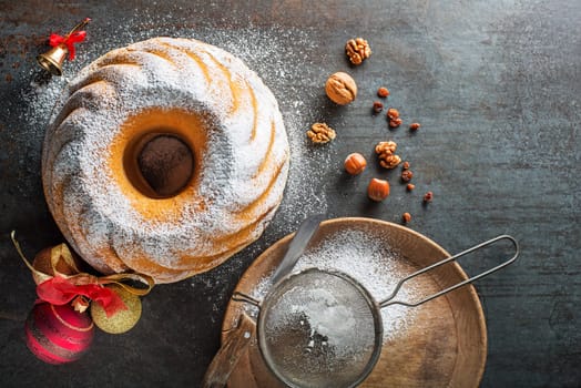 Potica, traditional Slovenian bread cake roll. Sweet bread roll stuffed with walnuts and sprinkle with sugar. Christmas holidays celebration dessert