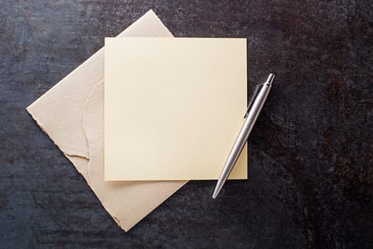 Writing letter on blank paper on grey background