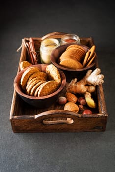 Delicious healthy homemade cereal oatmeal cookies and gingerbread cookies served on tray background