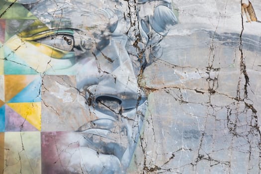 Colonnata, Italy - August 08 2024: famous David by Michelangelo copy from the street artist Kobra, the most beautiful murales in Italy