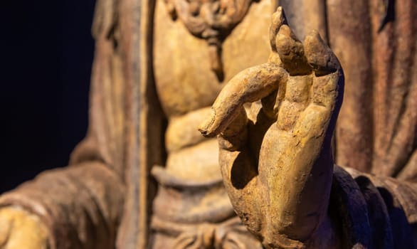 Ancient Buddha hand. Concept of energy, ethnic, harmony, meditation, peace