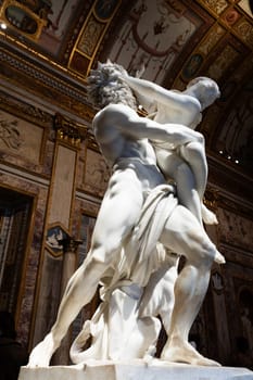 Rome, Italy - 28 December 2023: Galleria Borghese - Borghese Gallery - The rape of Proserpina, by Gian Lorenzo Bernini, 1622 - white Carrara marble statue