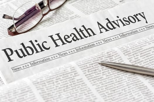A newspaper with the headline Public Health Advisory