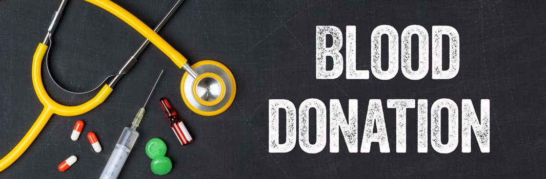 Stethoscope and pharmaceuticals on a blackboard - Blood donation