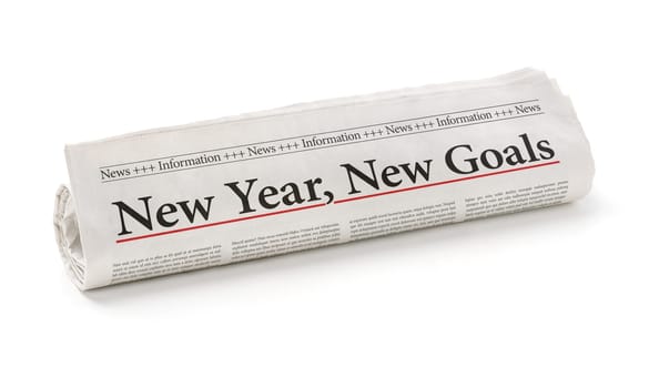 Rolled newspaper with the headline New year, new goals