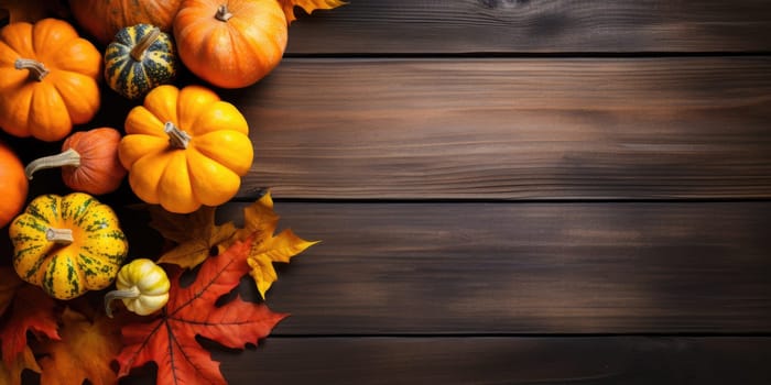 Autumn leaves and pumpkins on wooden background with copyspace - AI generated