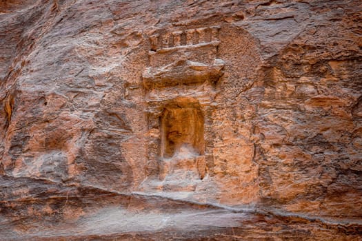 Arched niche with betylene on the wall of Siq canyon in Petra, Jordan.. Horizontally.