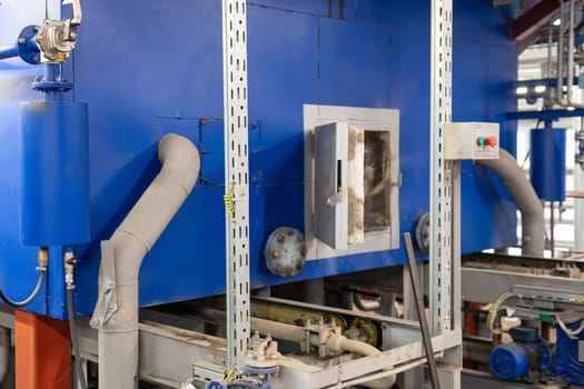Modern industrial steam boiler room equiped for heating process.