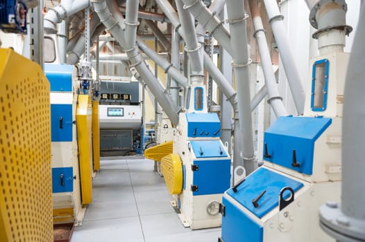 Roller deck machines for husking buckwheat grain, operating in a modern processing facility.