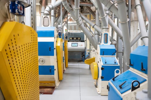 Roller deck machines for husking buckwheat grain, operating in a modern processing facility.