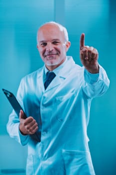 Mature male doctor wearing a lab coat is holding a clipboard and pointing his index finger upwards, signifying an important medical instruction or recommendation