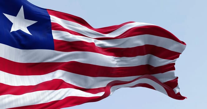 National flag of Liberia waving on a clear day. Red and white horizontal stripes that change color and a white star on the blue square in the canton. 3d illustration render. Rippling fabric
