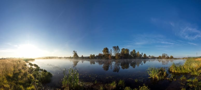 Lakes in the autumn forest. Forest autumn landscape, beautiful nature.