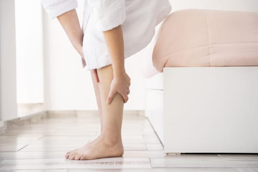 close up hands massaging legs