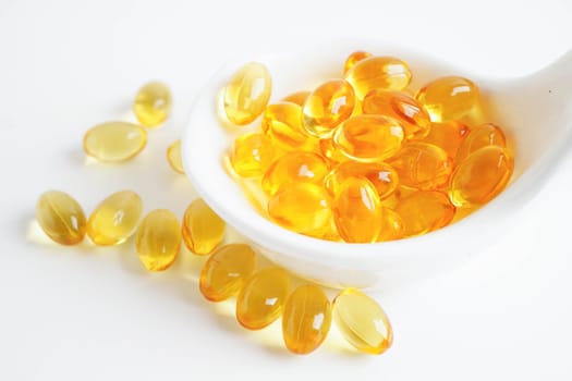 Fish oil or Cod liver oil gel in capsules with omega 3 vitamins, supplementary healthy food.