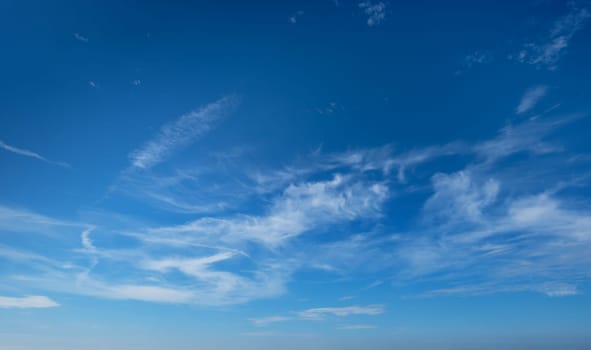 Clear Blue Sky with Whispy White Clouds - Perfect for Nature and Weather Backgrounds