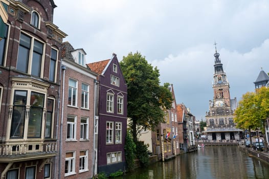 Alkmaar, Netherlands, - View of the city and the weighing house, with the water canal in the foreground