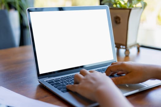 Human hand use laptop and looking at it, Blank screen tablet with white background for advertising text, Woman using laptop contact business search information, Marketing and creative design.