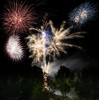Firework display on the night sky at a festival