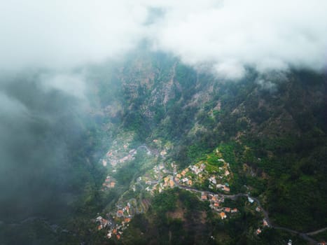 Aerial drone view of Curral das Freiras village in Valley of the Nuns from Miradouro da Eira do Serrado, Madeira island, Portugal