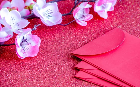 Red packets with customizable space for Chinese New Year wishes.