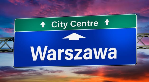 Road sign indicating direction to the city of Warszawa, Poland.